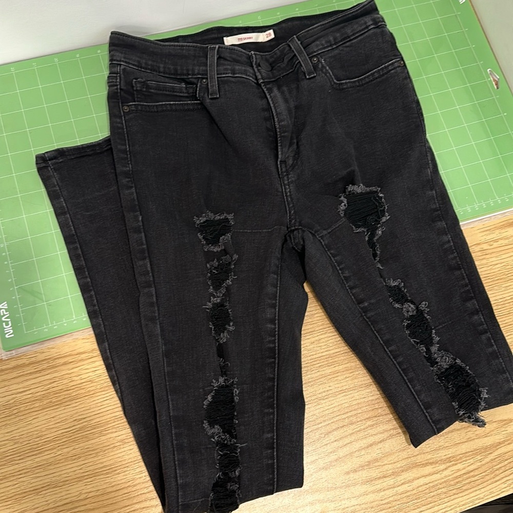 Levi’s 711 skinny black ripped jeans